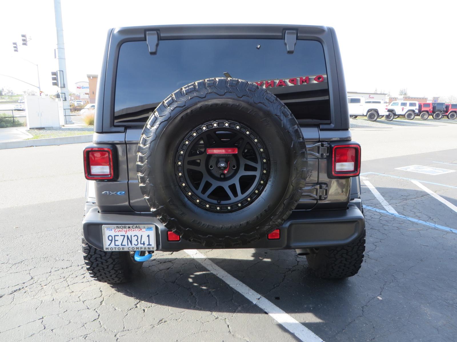 2023 CHARCOAL /black Jeep Wrangler Unlimited Willys 4XE (1C4JJXN68PW) with an 2.0L L4 DOHC 16V HYBRID engine, 8A transmission, located at 2630 Grass Valley Highway, Auburn, CA, 95603, (530) 508-5100, 38.937893, -121.095482 - 3" Zone Offroad lift kit, Fox Adventure series shocks, 17" Method Race wheels, 37" BFG KO2 tires, and a Teraflex spare tire carrier. - Photo #5